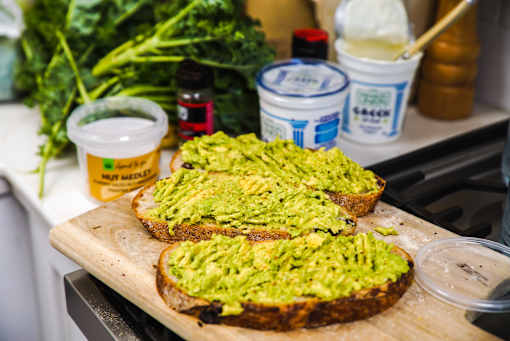 a picture of avocado toast on a cutting board