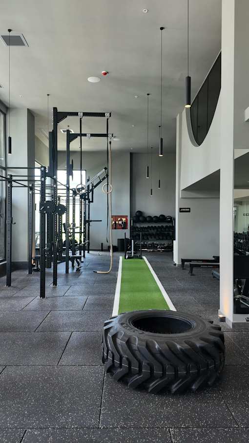 A tire is on the floor in front of a gym.