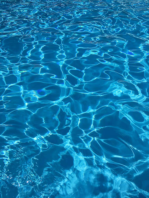 A close up view of the rippling water in a pool.
