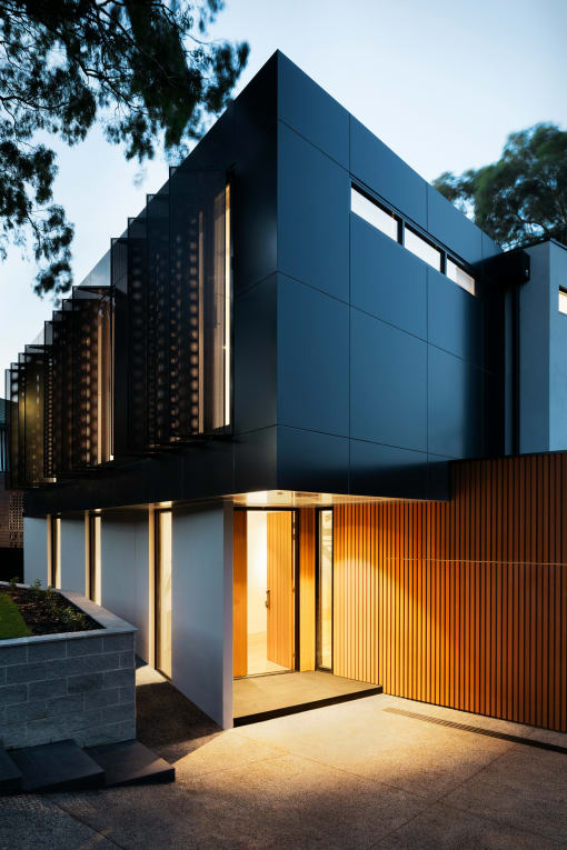 the front facade of a modern house with a front door