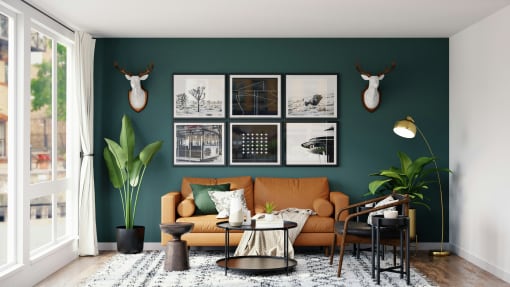 a living room with a green wall and a brown couch