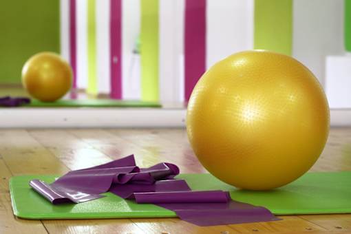 Yoga mat and ball in gym