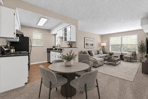 A modern kitchen with a dining table set for two.
