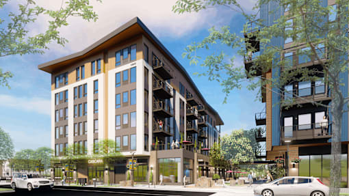 A modern building with a mix of wood and glass is depicted in the image.