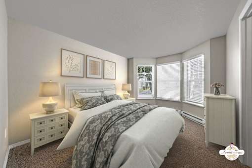 A bedroom with a bed, nightstand, and window with blinds.