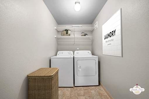 A laundry room with a washer and dryer.