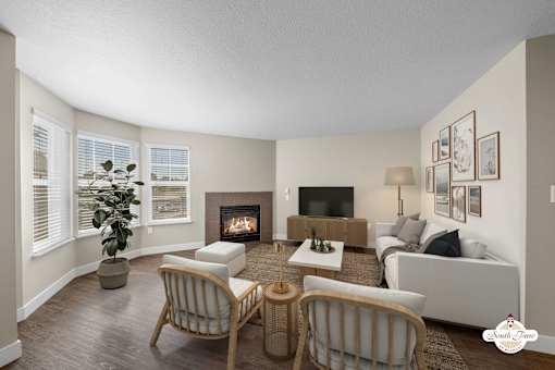 A living room with a fireplace and a couch.