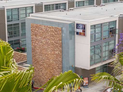 A building with a sign that says "LOFT 2015" on it.