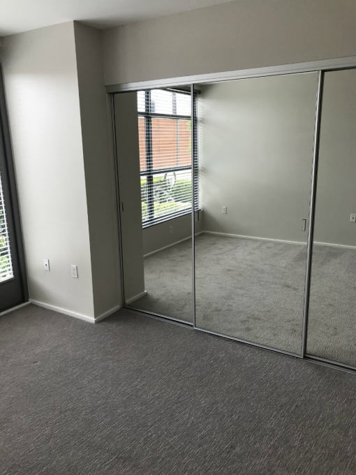 Master bedroom of Allure floorplan with mirrored glass closet