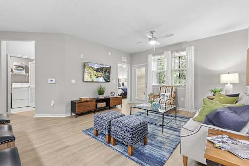 A living room with a couch, chair, and a coffee table.
