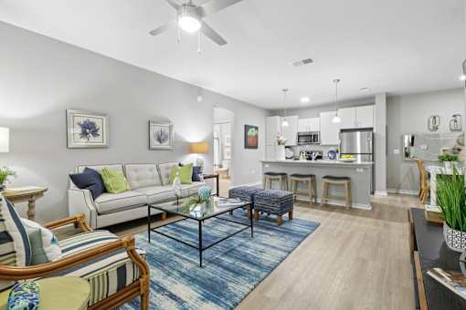 A living room with a white couch and a coffee table.