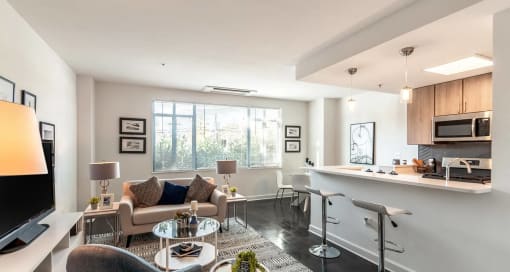Dominion Living Room With Partial Kitchen Views