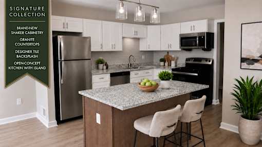 A kitchen with granite countertops and white cabinets.