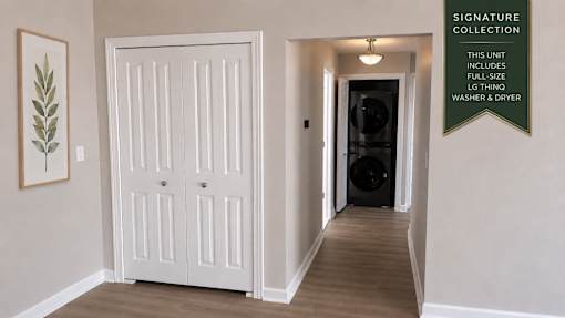 A white door in a room with a sign on the wall.