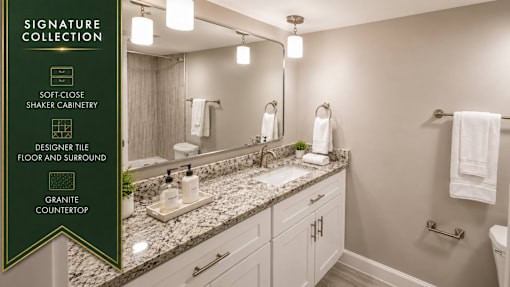A bathroom with granite countertops and a designer tile floor.