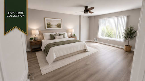 A bedroom with a large bed and a ceiling fan.