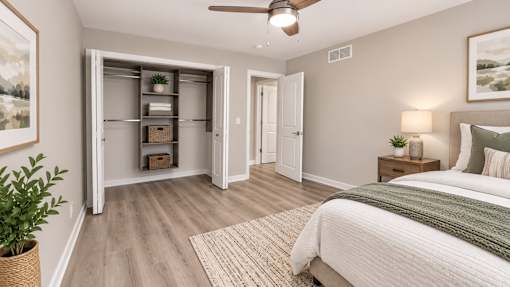 A bedroom with a bed, a ceiling fan, and a closet with shelves.