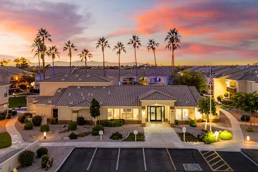Main leasing office at dusk - Arrowhead Landing Apartments