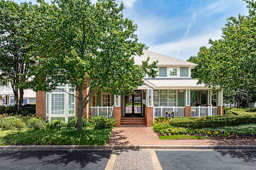 Clubhouse and leasing office exterior - Belle Harbour Apartments