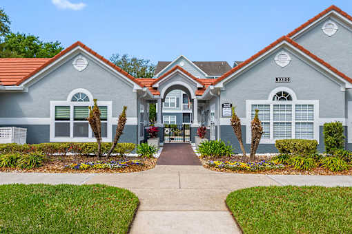 Walkway to leasing office, clubroom and swimming pool - The Colony at Deerwood Apartments