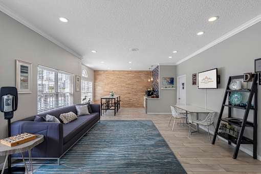 Resident area with lounge seating - The Colony at Deerwood Apartments