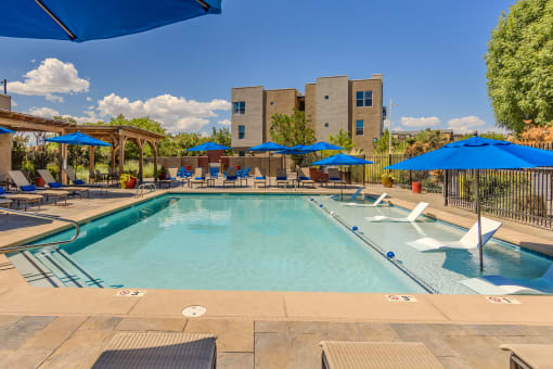 Resort-style swimming pool with sun deck - ABQ Uptown Apartments