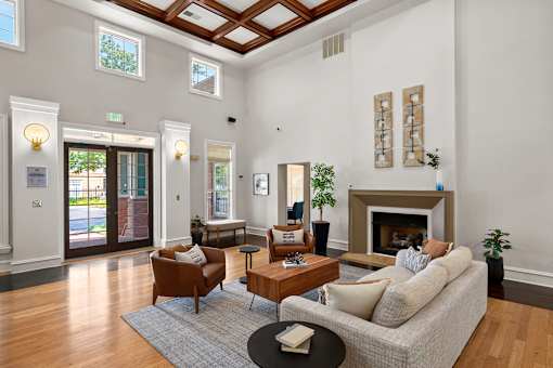 Clubhouse great room with fireplace - Belle Harbour Apartments