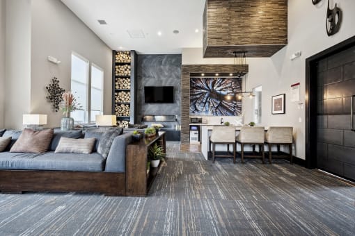 a living room with a couch and a table with chairs