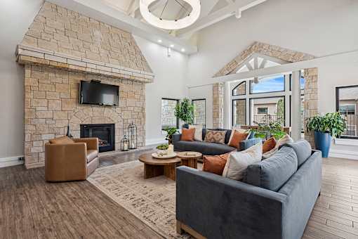 Resident clubhouse lounge with fireplace - Grand Centennial Apartments