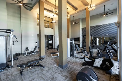 The Juncture Apartments fitness center with cardio equipment