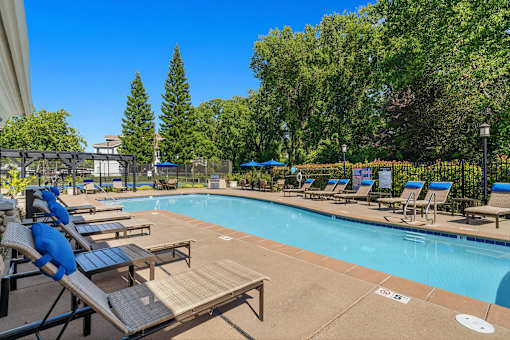 Ample lounge seats at the resort-style swimming pool - Preserve at Blue Ravine