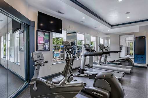 Fully-equipped fitness center with cardio - Lantern Woods Apartments