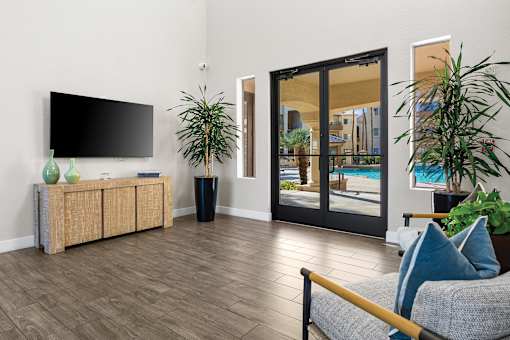 Resident clubhouse with tv option available - Sonterra Apartments at Paradise Valley