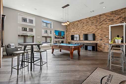 Game room with billiards table - First and Main Apartments