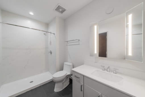 a bathroom with a sink toilet and a shower