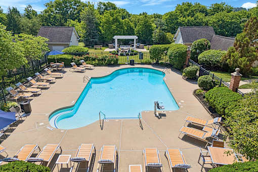 Resort-style swimming pool with lounge seating - Avenel at Montgomery Square