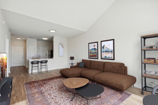 Spacious living room with wood-look flooring - Avenel at Montgomery Square