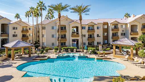 Resort-style swimming pool with ample lounge chairs available - Sonterra Apartments at Paradise Valley