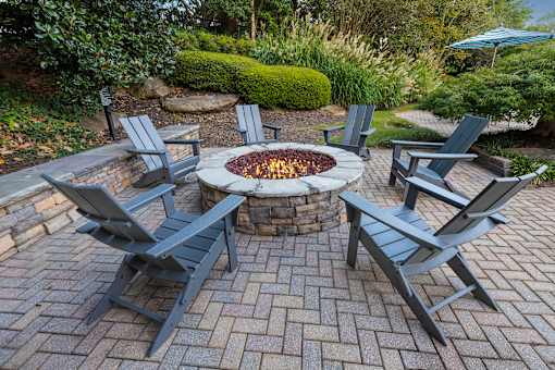 Fire pit with seating - Evergreen Lenox Park