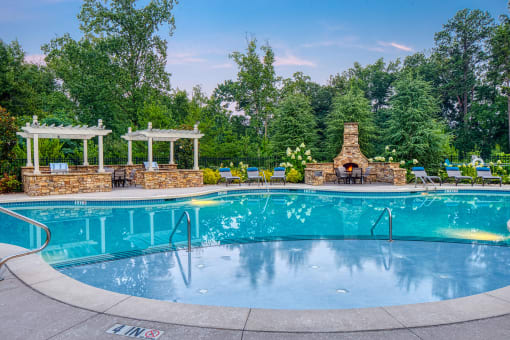 The Oaks at Johns Creek - Saltwater swimming pool with BBQ grills and fireplace social area