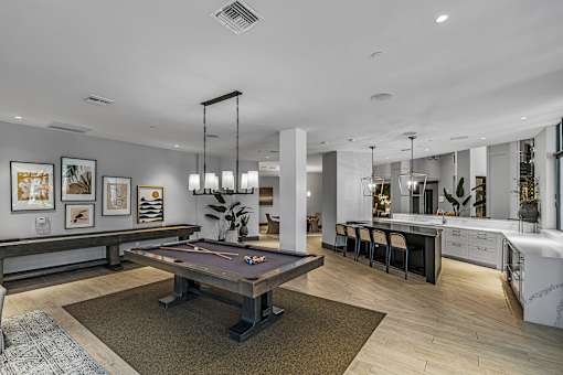 Game room with billiards table, shuffleboard and giant scrabble - The Remy Apartments
