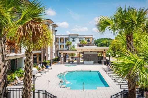 Centre Pointe Apartments resort-style pool area with surrounding sundeck
