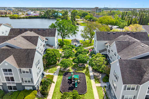 Apartment complex with a playground in the middle.