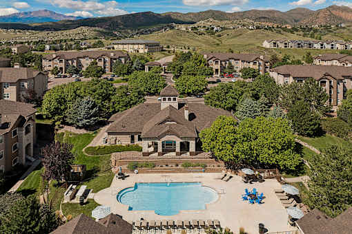 Aerial view of the resort-style swimming pool and property - Grand Centennial Apartments