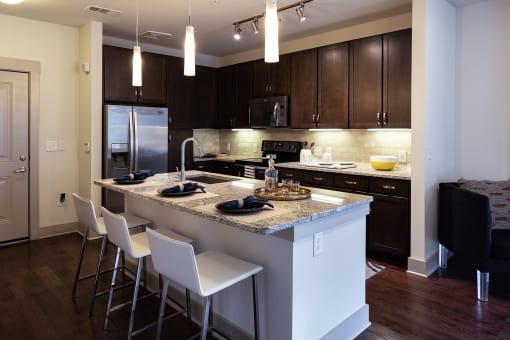 The Juncture Apartments brown kitchen cabinets