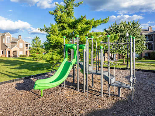 Playgrounds with green slide - Lantern Woods Apartments