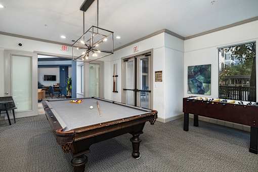 Pool table in game room - Monterra Las Colinas Apartments
