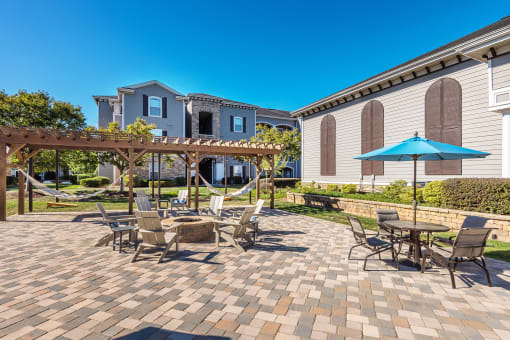 Outdoor lounge with fire pit - The Crossings at Alexander Place