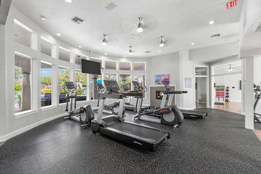 Fitness center with cardio equipment - Egret's Landing Apartments