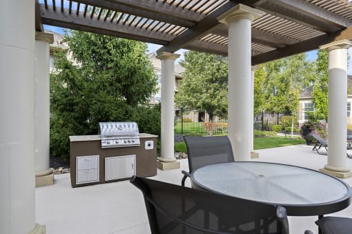The Fairways at Corbin Park poolside cabana with BBQ grill and seating